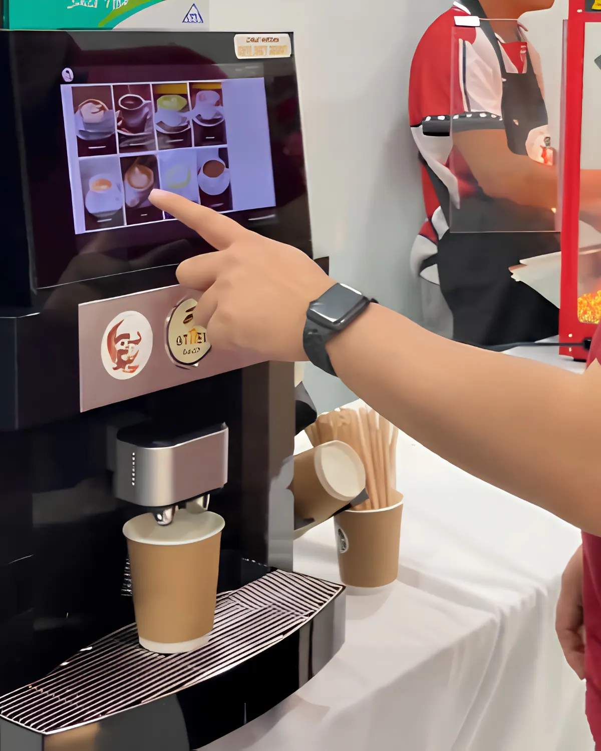 A compact tabletop Otter machine at a small gathering