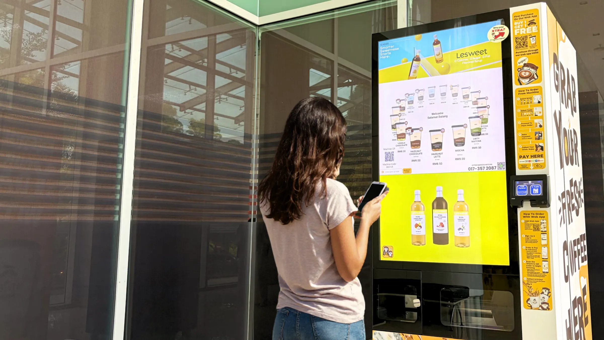 An advert playing on an Otter machine screen while someone orders
